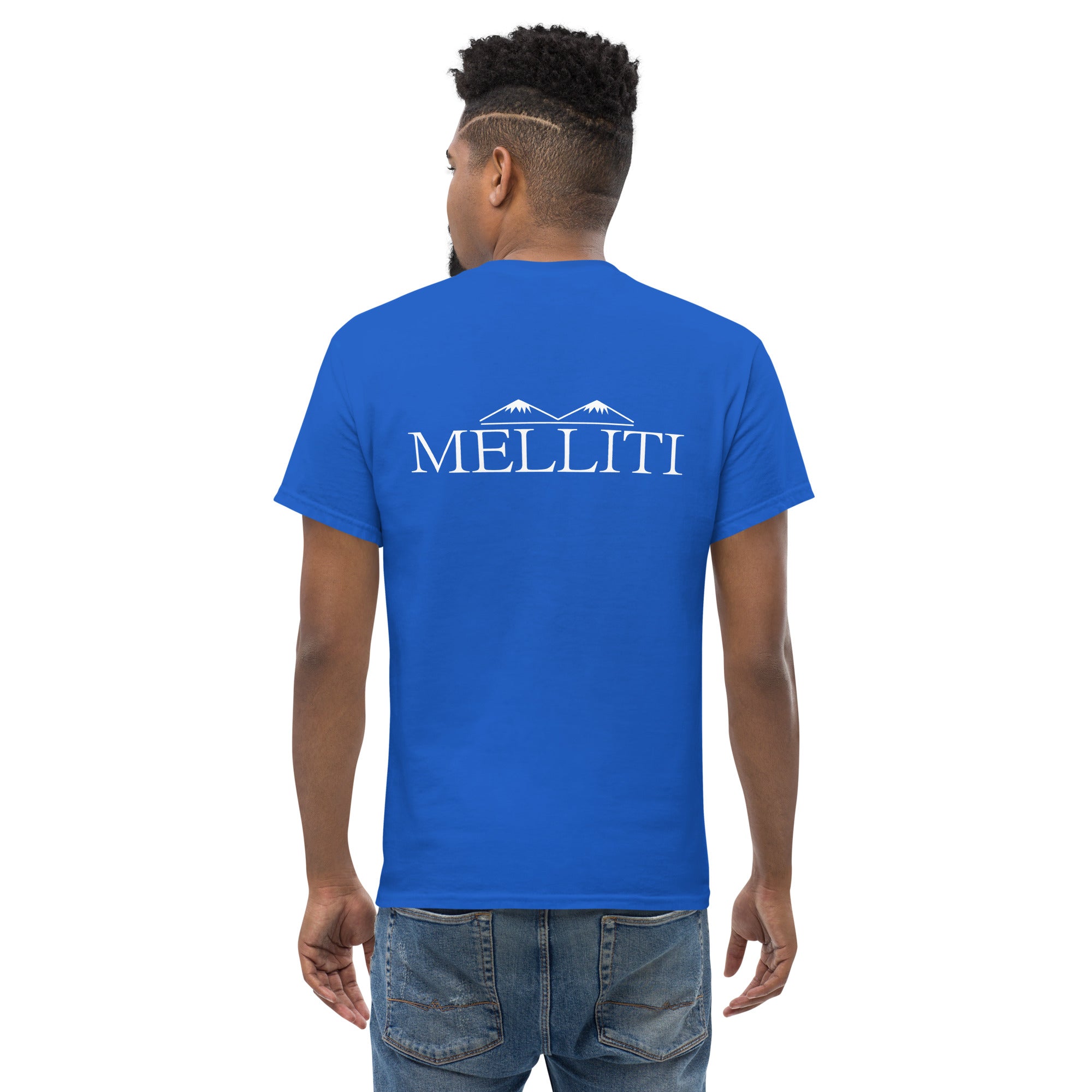 MELLITI MOUNTAINS TEE displayed on a man wearing a blue cotton t-shirt with the MELLITI logo on the back.