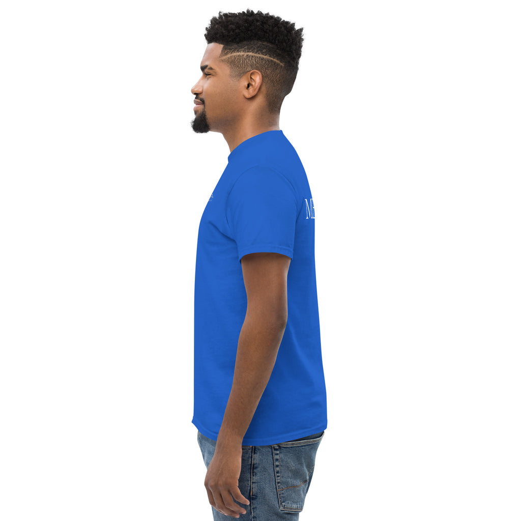Profile view of a man wearing a blue MELLITI MOUNTAINS TEE featuring a structured look and sharp edges.